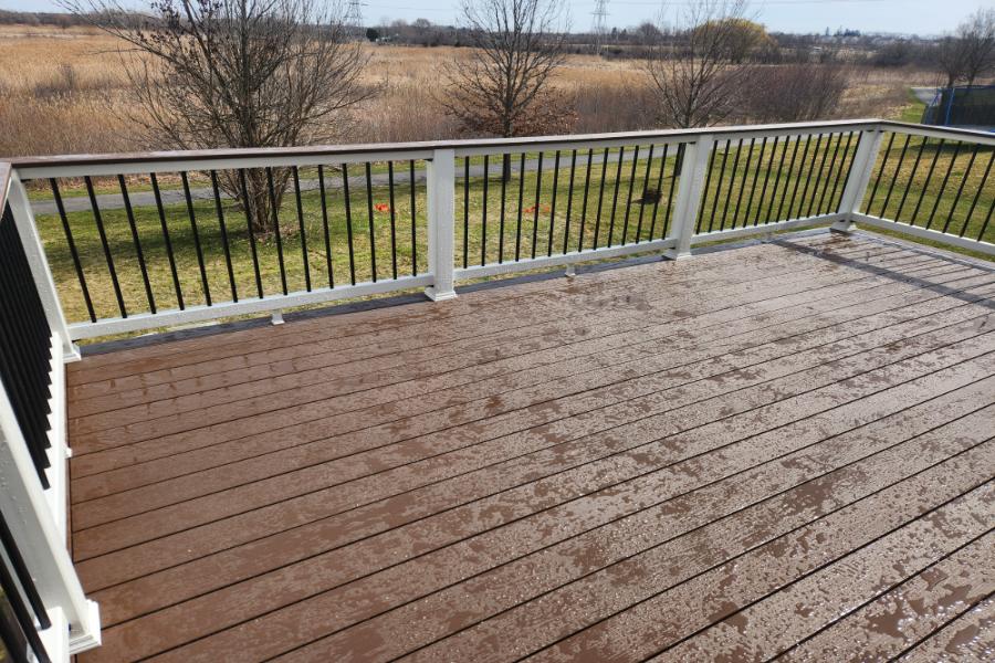 Timbertech® Terrain Rustic Elm with Continuous Top Rail in Rustic Elm with Trex® Transcend Rails Round Lake